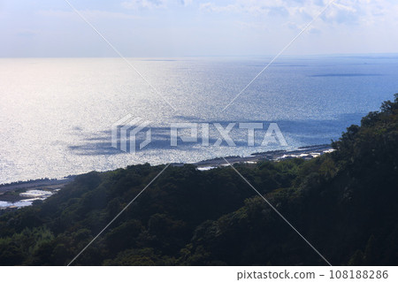 A clear blue sky and a beautiful view of the sea from the mountaintop: a stunning landscape photo showcasing abundant nature and a sense of freedom. A clear blue sky and a beautiful view of the sea from the mountaintop: a stunning landscape photo showcasing abundant nature and a sense of freedom. 108188286