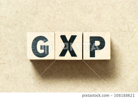 Alphabet letter block in word GXP on wood background Alphabet letter block in word GXP on wood background 108188621