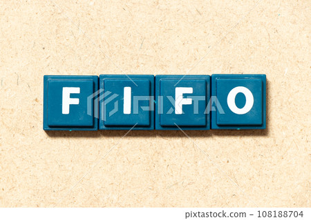 Tile alphabet letter in word FIFO (Abbreviation of first in first out) on wood background Tile alphabet letter in word FIFO (Abbreviation of first in first out) on wood background 108188704