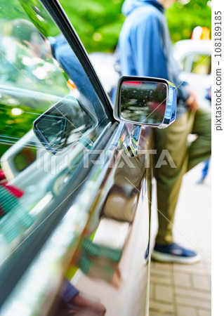 Side mirror on a vintage car. Vintage car parts.  Side mirror on a vintage car. Vintage car parts.  108189185