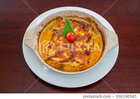 Homemade Vegetarian Lasagna with Tomato and Basil Sauce on wooden table. 108190565