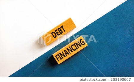 Debt financing symbol. Concept words Debt financing on wooden blocks on a beautiful blue table white background. Business finance and debt financing concept, copy space. 108190667