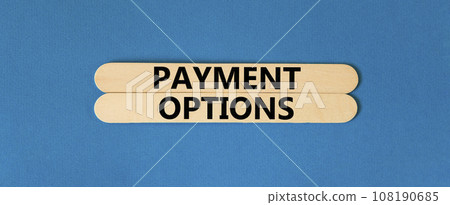 Payment options symbol. Concept words Payment options on beautiful wooden stick. Beautiful blue table blue background. Business payment options concept. Copy space. Payment options symbol. Concept words Payment options on beautiful wooden stick. Beautiful blue table blue background. Business payment options concept. Copy space. 108190685