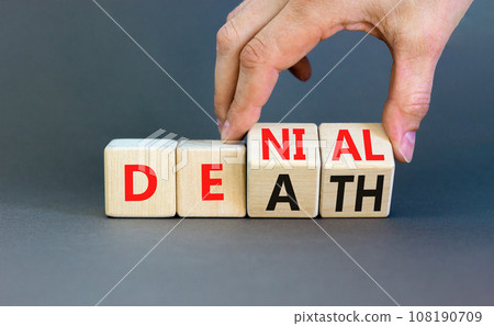 Denial death symbol. Concept words Denial Death on wooden block. Beautiful grey table grey background. Businessman hand. Business denial death concept. Copy space. 108190709