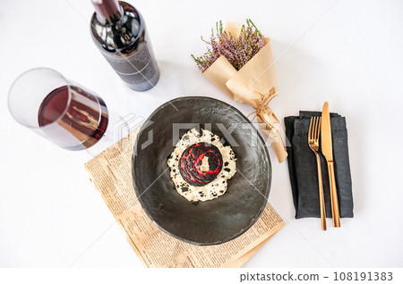 Choux Shu bun with beef, cream cheese, espuma parmesan and Borodino chips 108191383