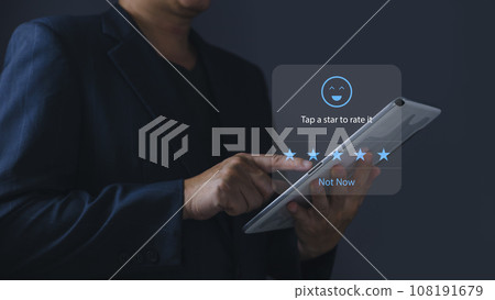 a businessman using application on tablet the virtual screen to give satisfaction in service.rating star very impressed.Customer service and Satisfaction concept. a businessman using application on tablet the virtual screen to give satisfaction in service.rating star very impressed.Customer service and Satisfaction concept. 108191679
