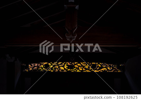 Ryoanji Temple in autumn, autumn-colored outdoor light leaking through the fretwork of the transom of the Imperial Envoy Gate Ryoanji Temple in autumn, autumn-colored outdoor light leaking through the fretwork of the transom of the Imperial Envoy Gate 108192625