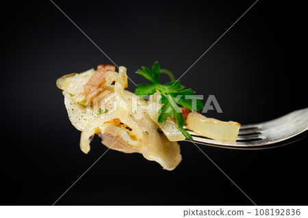 Ukrainian dumplings stuffed with potatoes and mushrooms, served with fried onions. 108192836