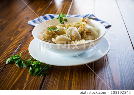 Ukrainian Vareniky or Pierogi stuffed with potato and mushrooms, served with fried onion. Ukrainian Vareniky or Pierogi stuffed with potato and mushrooms, served with fried onion. 108192843