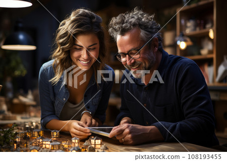 A man and a woman discuss a project in the evening in the office. business people meet in the office, analyze the results and formulate a strategy 108193455