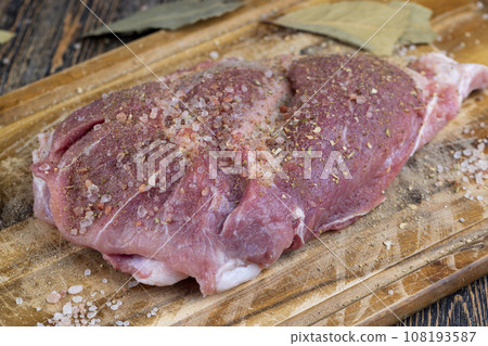 sliced piece of fresh raw pork during salting sliced piece of fresh raw pork during salting 108193587