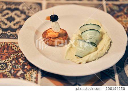 Creative presentation for the kid. The concept of a children's menu, proper nutrition. Funny ideas for kids, table setting, vegetable penguin. High quality photo Creative presentation for the kid. The concept of a children's menu, proper nutrition. Funny ideas for kids, table setting, vegetable penguin. High quality photo 108194250