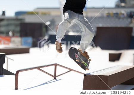 Skater balancing at the edge of a ramp Skater balancing at the edge of a ramp 108194255