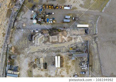Beginning of construction works on prepared ground. Large building site with scattered equipment in american rural area. Development of residential housing in US suburbs. Real estate market in USA 108194992