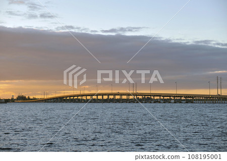 Barron Collier Bridge and Gilchrist Bridge in Florida with moving traffic. Transportation infrastructure in Charlotte County connecting Punta Gorda and Port Charlotte over Peace River 108195001
