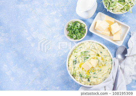 Irish dish Colcannon or mashed potato with green cabbage and butter, horizontal top view, copy space Irish dish Colcannon or mashed potato with green cabbage and butter, horizontal top view, copy space 108195309