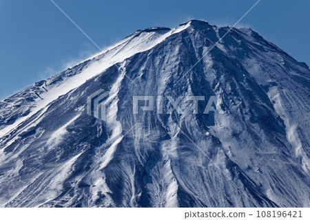 Mt. Fuji rising in snow as seen from Mt. Junigatake in the Misaka Mountains 108196421