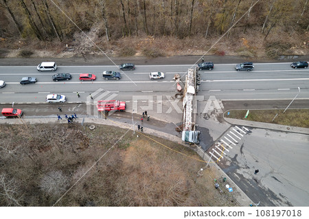 Aerial view of road accident with overturned truck blocking traffic Aerial view of road accident with overturned truck blocking traffic 108197018