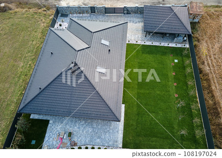 Aerial view of residential house with backyard in suburban rural area Aerial view of residential house with backyard in suburban rural area 108197024