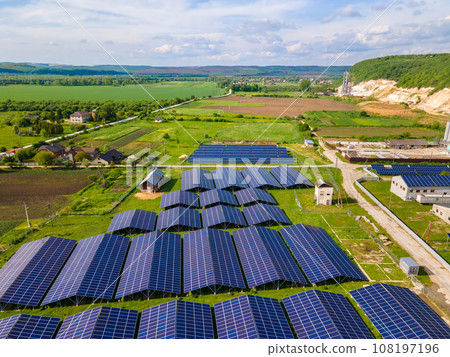 Aerial view of large sustainable electrical power plant with rows of solar photovoltaic panels for producing clean ecological electric energy. Renewable electricity with zero emission concept. 108197196