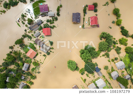 Aerial view of flooded houses with dirty water of Dnister river in Halych town, western Ukraine. Aerial view of flooded houses with dirty water of Dnister river in Halych town, western Ukraine. 108197279