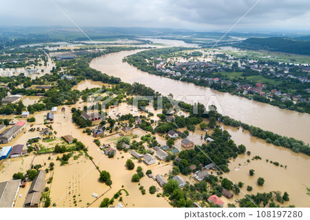 Aerial view of flooded houses with dirty water of Dnister river in Halych town, western Ukraine. 108197280