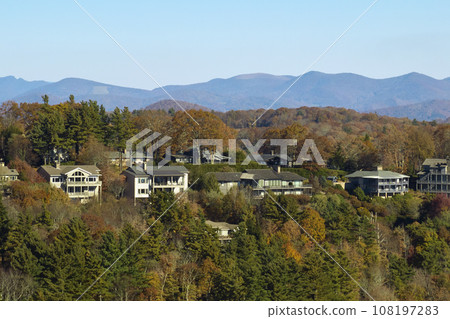 Aerial view of expensive american homes on hilltop in North Carolina mountains residential area. New family houses as example of real estate development in USA suburbs 108197283