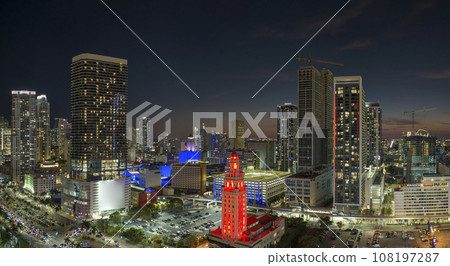 Aerial view of downtown office district of of Miami Brickell in Florida, USA at night. High commercial and residential skyscraper buildings in modern american megapolis 108197287