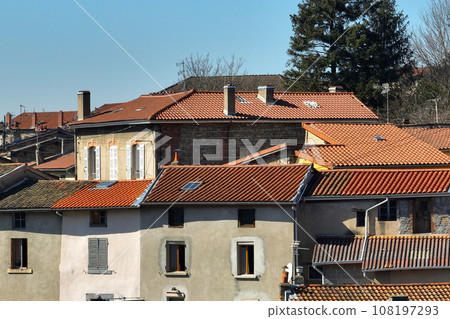Aerial view of dense historic center of Thiers town in Puy-de-Dome department, Auvergne-Rhone-Alpes region in France. Rooftops of old buildings and narrow streets Aerial view of dense historic center of Thiers town in Puy-de-Dome department, Auvergne-Rhone-Alpes region in France. Rooftops of old buildings and narrow streets 108197293
