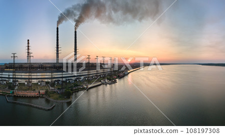 Aerial view of coal power plant high pipes with black smokestack polluting atmosphere. Electricity production with fossil fuel concept 108197308