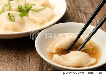 Boiled gyoza with chopsticks Boiled gyoza with chopsticks 108197383
