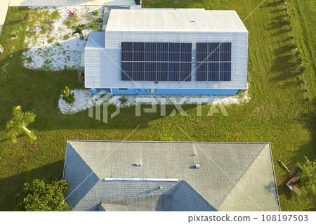 Aerial view building roof with rows of blue solar photovoltaic panels for producing clean ecological electric energy. Renewable electricity with zero emission concept 108197503