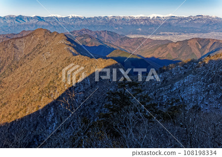 Mt. Odake and the Southern Alps mountain range seen from Mt. Yukitogatake in the Misaka Mountains in winter 108198334
