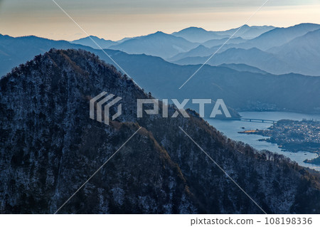Mt. Junigatake, Lake Kawaguchi and the mountains of Doshi and Tanzawa in the morning seen from Misaka Mountains and Mt. Yukitogatake Mt. Junigatake, Lake Kawaguchi and the mountains of Doshi and Tanzawa in the morning seen from Misaka Mountains and Mt. Yukitogatake 108198336