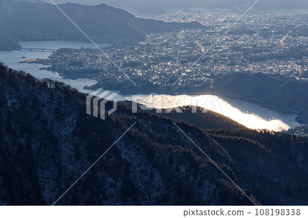 Lake Kawaguchi in the morning seen from Mt. Yukitogatake in the Misaka Mountains Lake Kawaguchi in the morning seen from Mt. Yukitogatake in the Misaka Mountains 108198338