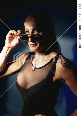 Sexy blonde fitness influencer with sunglasses Sexy blonde fitness influencer with sunglasses 108199431