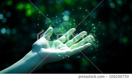 Hand touching light green sparkles and abstract glow on air 108200750