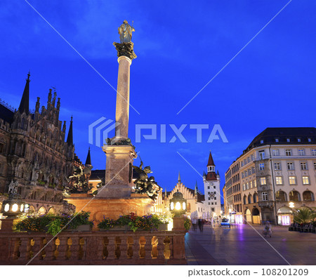 Mary's Square illuminated at dusk with the Old City Hall on the background in Munich, Germany 108201209