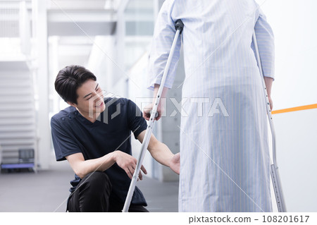 Physical therapist doing rehabilitation Physical therapist doing rehabilitation 108201617