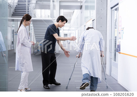 Physical therapist and doctor doing rehabilitation 108201620