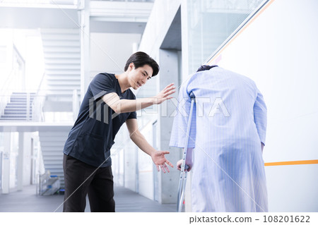 Physical therapist doing rehabilitation Physical therapist doing rehabilitation 108201622