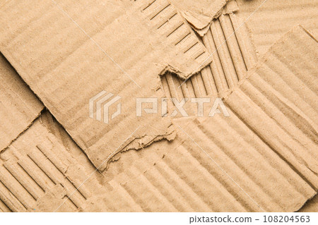 Pieces of torn cardboard as background, top view 108204563