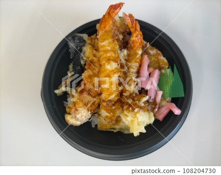 Bowl of rice and fried fish 108204730