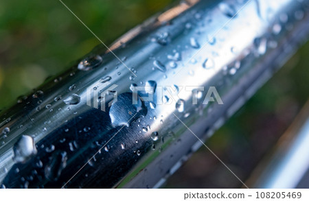 Water drops on the metal handrail of the stairs after the rain. 108205469
