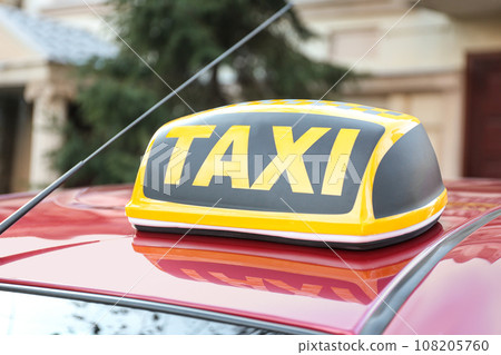 Roof light with word TAXI on car outdoors Roof light with word TAXI on car outdoors 108205760