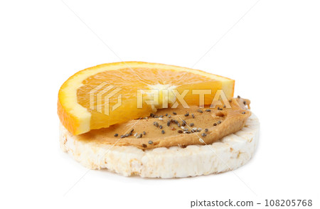 Puffed rice cake with peanut butter and orange isolated on white 108205768