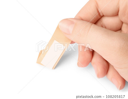 Woman putting sticking plaster on white background. First aid item Woman putting sticking plaster on white background. First aid item 108205817