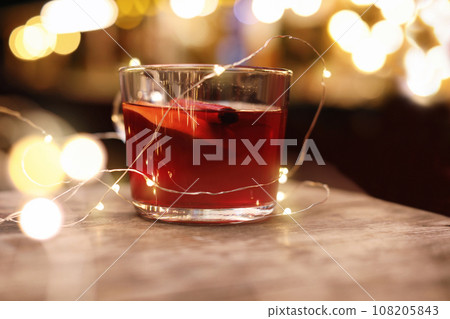 Tasty aromatic mulled wine on wooden table Tasty aromatic mulled wine on wooden table 108205843