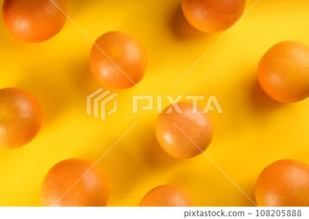 Tasty ripe grapefruits on yellow background, flat lay 108205888