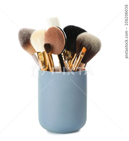 Set of professional makeup brushes in holder isolated on white 108206038